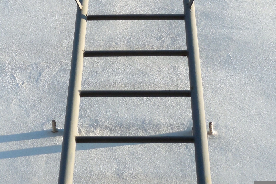 Never climb a vertical ladder without continuous fall protection