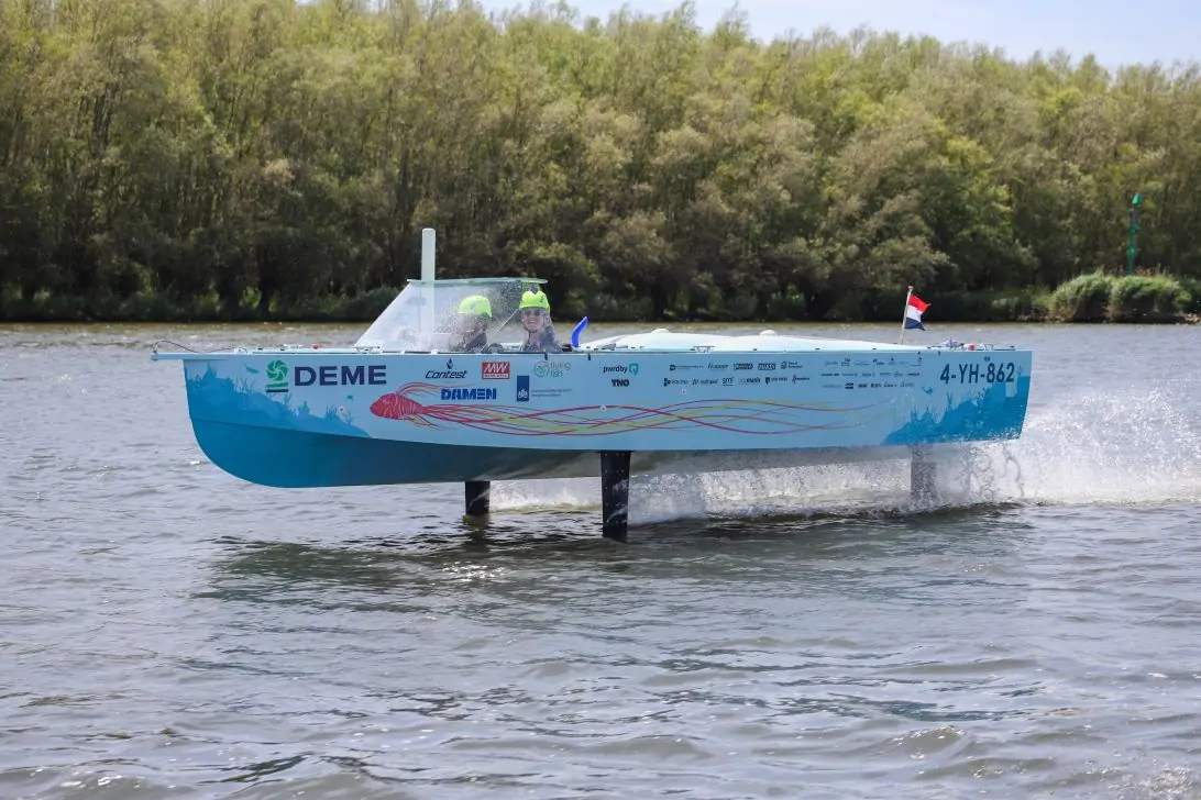 The 2025 boat ‘flying’ over the water using its hydrofoils (photo by TU Delft Hydro Motion Team)