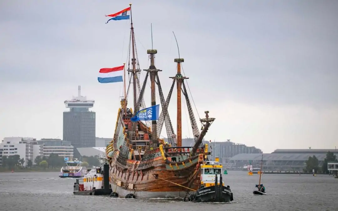 Batavia sailing past Amsterdam city centre